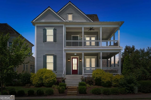 view of front of home featuring a balcony, covered porch, and ceiling fan