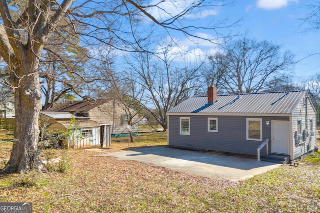 back of property with a patio area