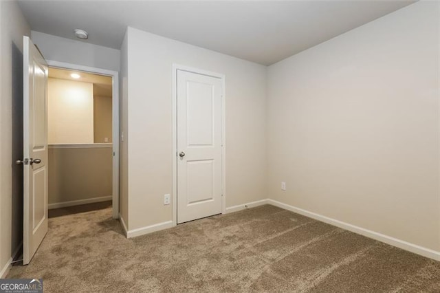 unfurnished bedroom with carpet flooring