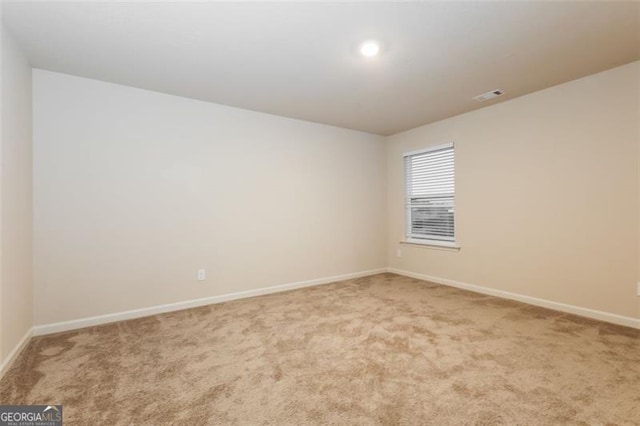 view of carpeted spare room