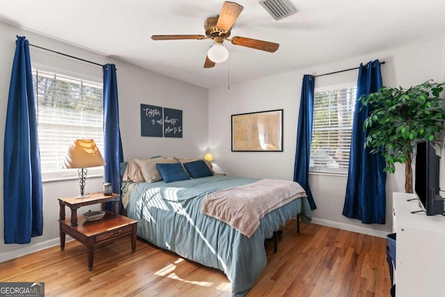 bedroom featuring hardwood / wood-style flooring and ceiling fan