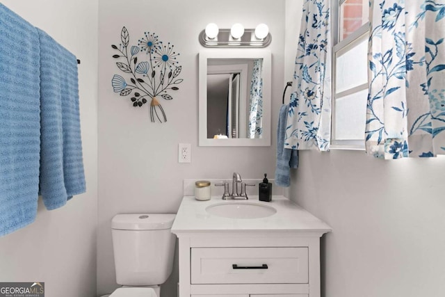 bathroom with vanity and toilet