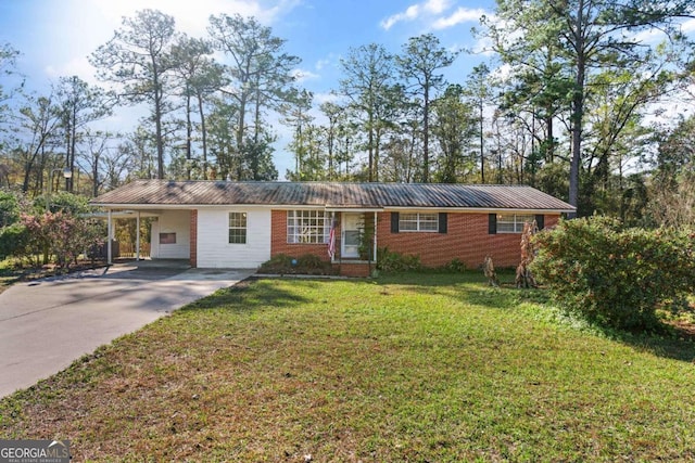 ranch-style house featuring a carport and a front lawn