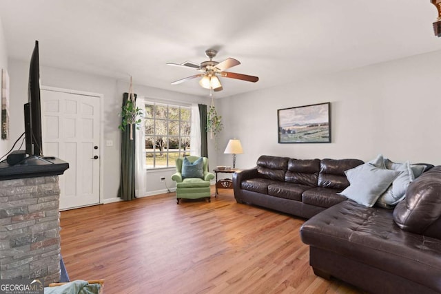 living room with hardwood / wood-style floors and ceiling fan