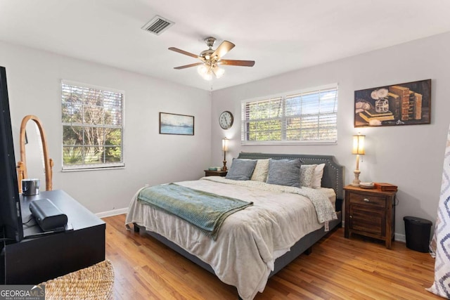 bedroom featuring ceiling fan and light hardwood / wood-style floors