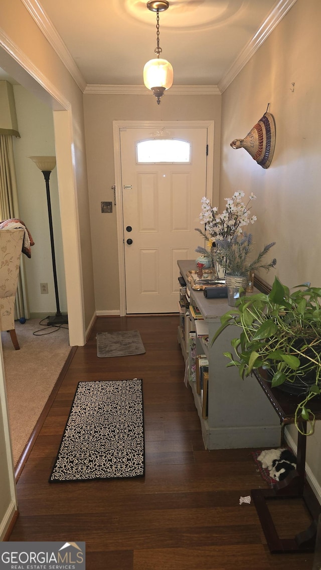 foyer featuring crown molding and dark wood-type flooring