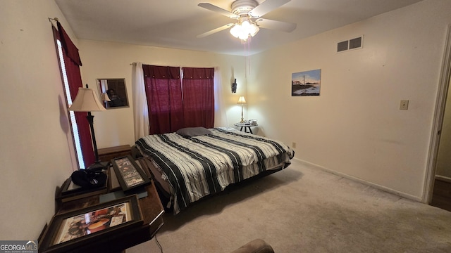 bedroom with ceiling fan and light colored carpet