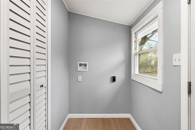 laundry room featuring wood-type flooring, electric dryer hookup, and washer hookup