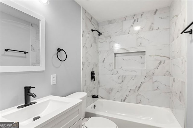 full bathroom with vanity, toilet, and tiled shower / bath combo