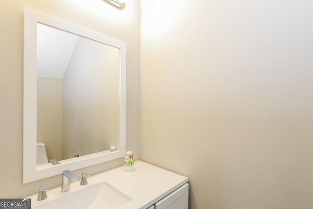 bathroom with vanity and toilet