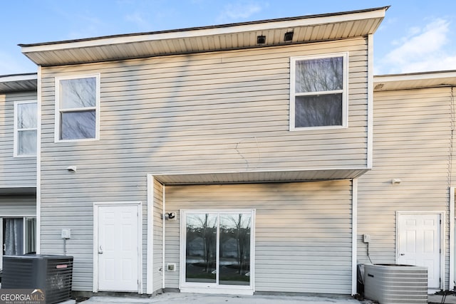 rear view of property featuring cooling unit