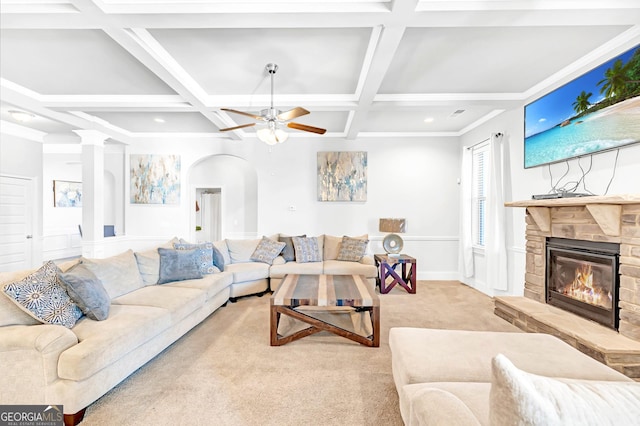 carpeted living room featuring beamed ceiling, ceiling fan, coffered ceiling, and a fireplace