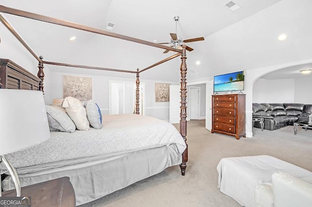 bedroom featuring ceiling fan, lofted ceiling, and light carpet