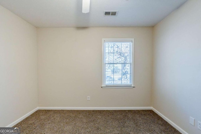 unfurnished room featuring carpet floors