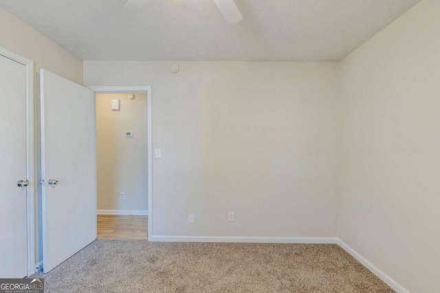 empty room with light colored carpet