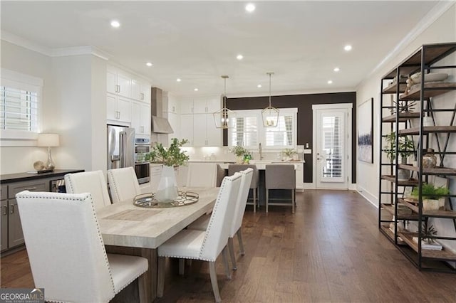 dining area featuring crown molding and dark wood-type flooring