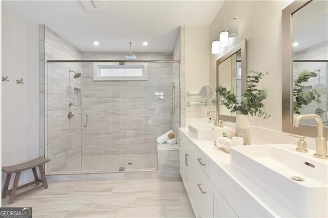 bathroom featuring vanity and a shower with shower door