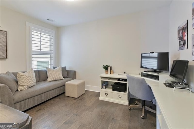 home office featuring hardwood / wood-style floors