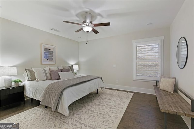 bedroom with hardwood / wood-style flooring and ceiling fan