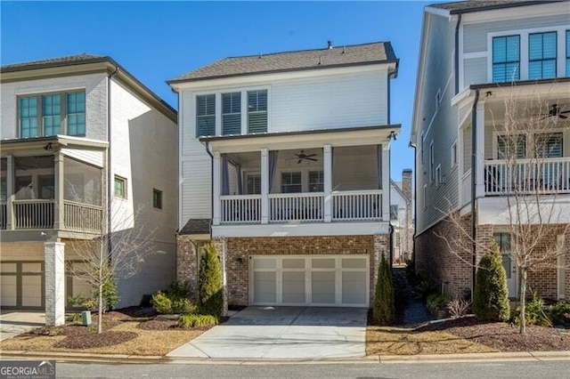 view of front of house with a garage and ceiling fan