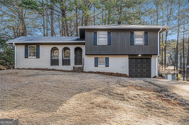 split level home with a garage