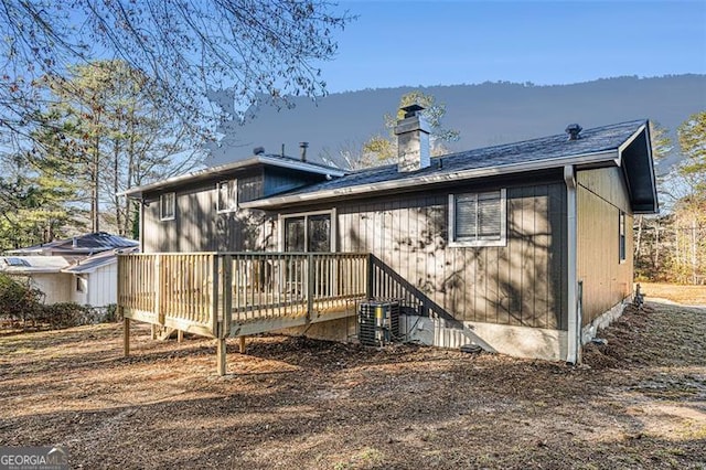 rear view of property with a deck