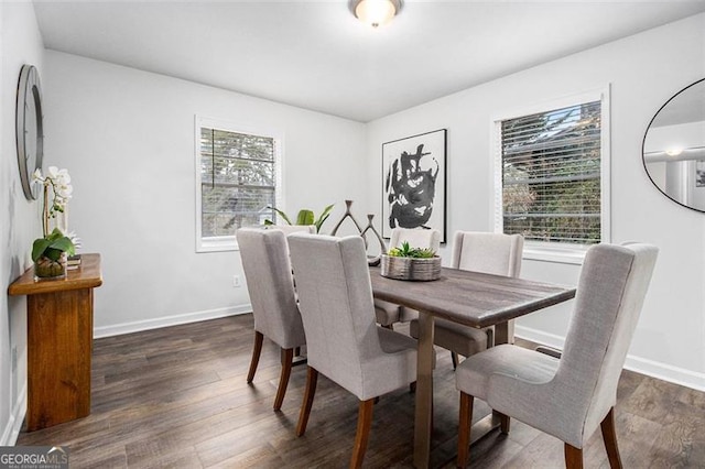 dining space featuring dark hardwood / wood-style floors