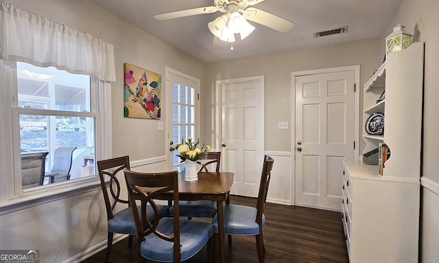 dining area featuring ceiling fan and dark hardwood / wood-style floors