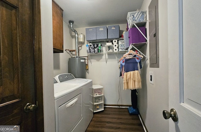 laundry room with water heater, washer and dryer, dark wood-type flooring, and cabinets