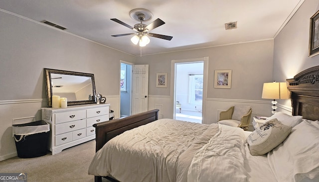 bedroom with ornamental molding, light colored carpet, ceiling fan, and ensuite bathroom