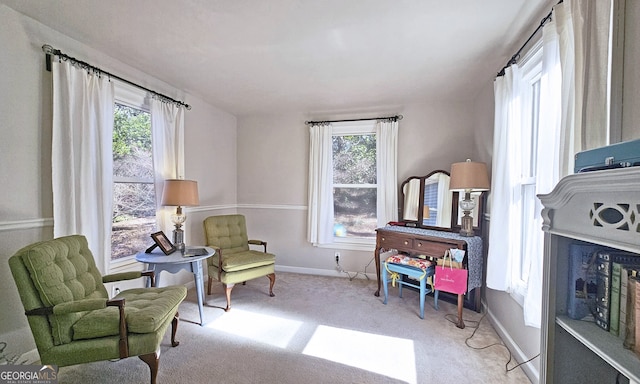 living area with light carpet and a wealth of natural light