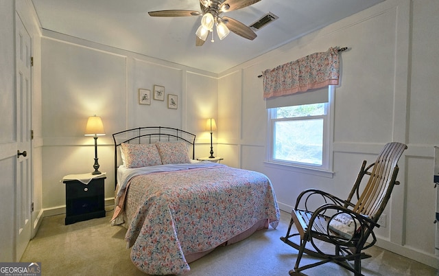 bedroom with ceiling fan and light colored carpet