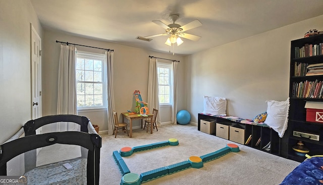 recreation room featuring ceiling fan and carpet flooring