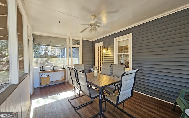 sunroom featuring ceiling fan