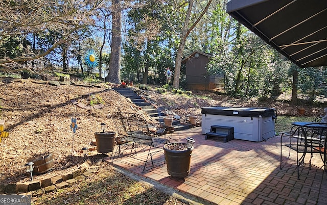 view of patio / terrace featuring a hot tub