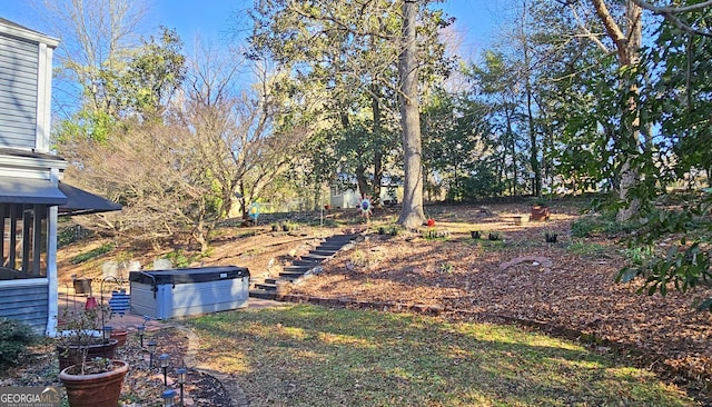 view of yard featuring a hot tub