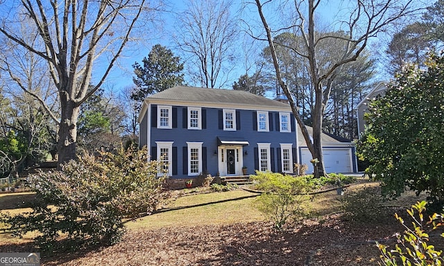 colonial home with a garage