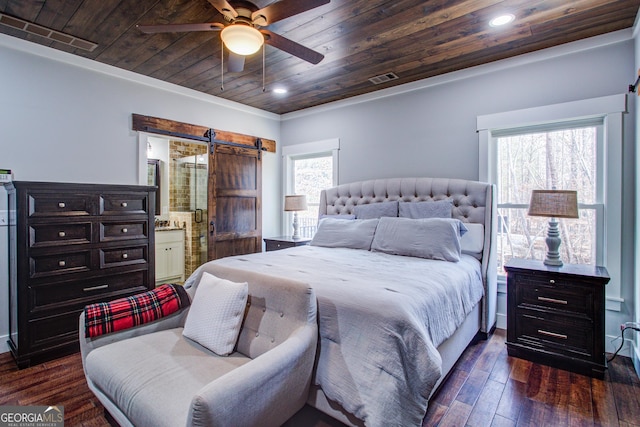 bedroom with dark wood-style floors, recessed lighting, visible vents, a barn door, and wooden ceiling