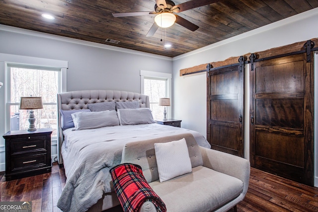 bedroom featuring dark wood-type flooring, wood ceiling, visible vents, and a barn door