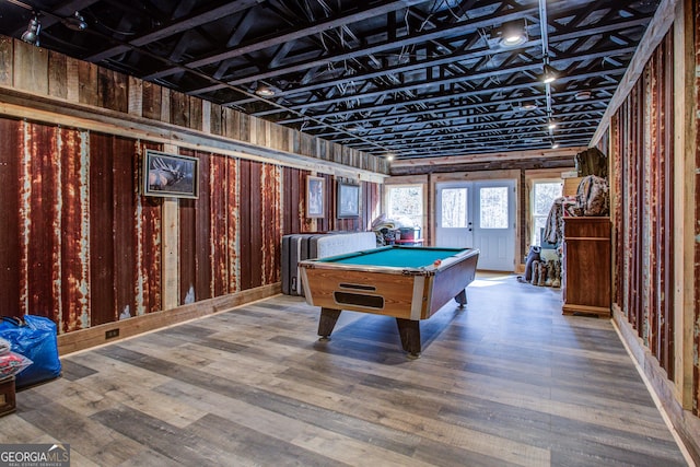 game room with pool table, french doors, and wood finished floors