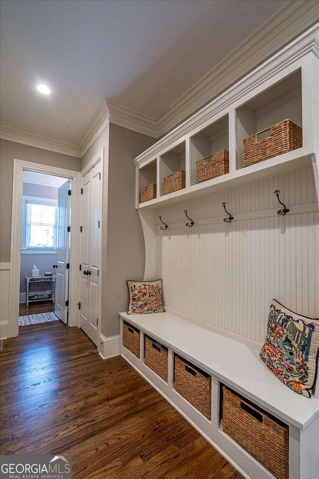 mudroom featuring baseboards, ornamental molding, and dark wood-style flooring