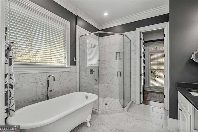 bathroom featuring crown molding, separate shower and tub, and vanity