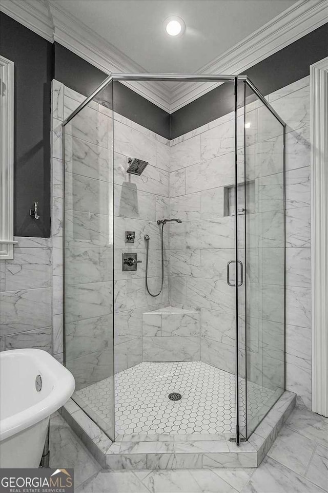 bathroom featuring sink, crown molding, and plus walk in shower