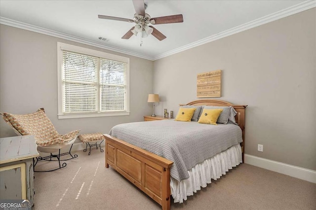 carpeted bedroom with crown molding and ceiling fan