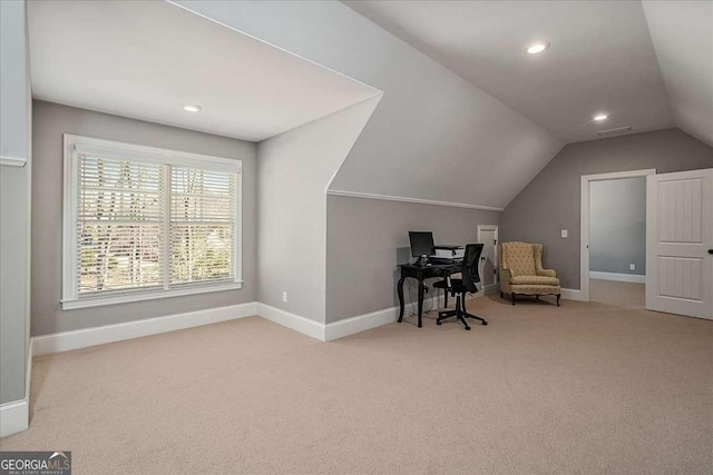 carpeted office space with lofted ceiling