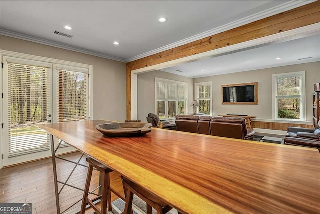 dining area with crown molding, french doors, visible vents, and recessed lighting