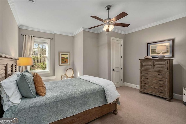 bedroom featuring carpet, crown molding, baseboards, and a ceiling fan