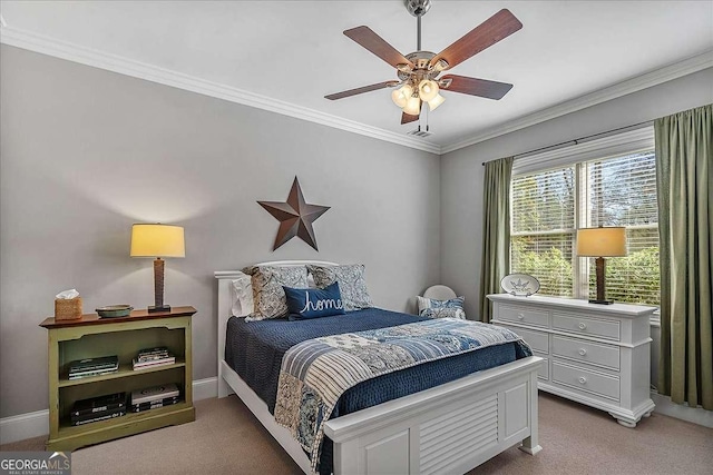 carpeted bedroom with ornamental molding and ceiling fan