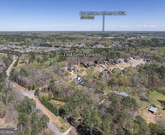 aerial view with a wooded view