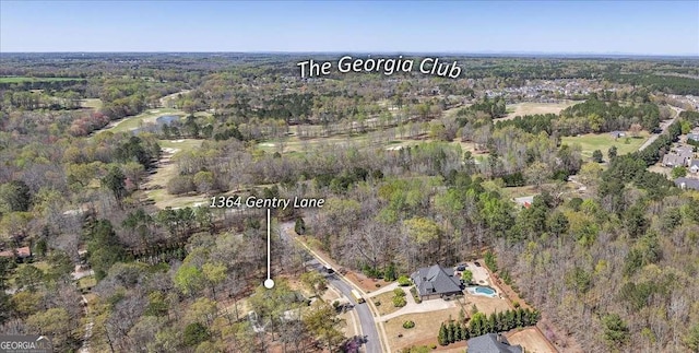 bird's eye view featuring a forest view